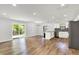 Open-concept layout with stainless appliances, island seating, and a walk out to the backyard at 3237 Thurston Dr, Indianapolis, IN 46224
