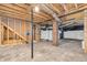 Unfinished basement with exposed ductwork, brick columns, and unfinished walls at 353 S Indiana St, Danville, IN 46122