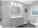 Bathroom vanity with designer mirror, sink, and decorative light fixture at 353 S Indiana St, Danville, IN 46122