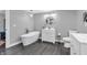 Serene bathroom offers a soaking tub, dual vanities, modern fixtures, and elegant finishes for a spa-like experience at 353 S Indiana St, Danville, IN 46122