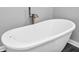 Bright bathroom featuring modern white standalone tub with silver hardware and fixtures at 353 S Indiana St, Danville, IN 46122