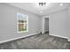 Clean bedroom features neutral paint, plush carpet and a bright window with view of the outdoors at 353 S Indiana St, Danville, IN 46122