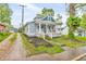 Charming blue two-story home with a welcoming front porch and well-maintained landscaping at 353 S Indiana St, Danville, IN 46122