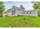 Quaint blue two-story home with a cozy front porch and lush green lawn at 353 S Indiana St, Danville, IN 46122