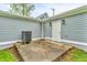 Exterior view showcasing the siding, backyard patio, and white door with modern sconces at 353 S Indiana St, Danville, IN 46122