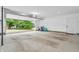 Spacious garage with open door, concrete floor, and access to backyard at 353 S Indiana St, Danville, IN 46122