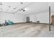 A bright, spacious garage featuring a clean concrete floor, white walls, and ample storage space at 353 S Indiana St, Danville, IN 46122