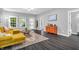 Inviting living room with hardwood floors and large windows providing natural light at 353 S Indiana St, Danville, IN 46122