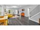 Open-concept living area with hardwood floors and a view into the dining space at 353 S Indiana St, Danville, IN 46122