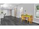 Living space featuring hardwood floors, sliding barn doors, and natural light at 353 S Indiana St, Danville, IN 46122