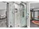 Modern shower stall with glass enclosure, intricate tiling, rainfall shower head, and multiple spray jets at 353 S Indiana St, Danville, IN 46122