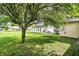 Spacious backyard featuring a hammock hanging beneath a mature tree at 356 Daugherty St, Columbus, IN 47201