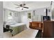 Bedroom features a ceiling fan, windows, and a neutral color scheme at 356 Daugherty St, Columbus, IN 47201