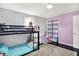 Cozy bedroom with bunk beds, a desk, and a closet, offering a comfortable and functional living space at 356 Daugherty St, Columbus, IN 47201