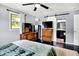 Bright bedroom with a window and dressers and access to the bathroom at 356 Daugherty St, Columbus, IN 47201