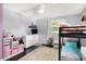 Spacious bedroom featuring bunk beds, a dresser, and ample storage, perfect for a growing Gathering at 356 Daugherty St, Columbus, IN 47201