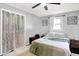 Bedroom featuring a ceiling fan, window, and neutral color scheme at 356 Daugherty St, Columbus, IN 47201