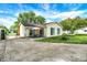 Rear exterior with patio seating area and well maintained lawn at 356 Daugherty St, Columbus, IN 47201
