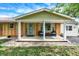 Inviting front porch with a seating area and welcome decor creates a warm and welcoming first impression at 356 Daugherty St, Columbus, IN 47201