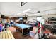 Spacious garage featuring a pool table and storage, offering a versatile and functional space at 356 Daugherty St, Columbus, IN 47201