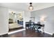 Bright home office with sleek black desk and shelving adjacent to the living room at 356 Daugherty St, Columbus, IN 47201