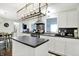 Bright kitchen features an island, stainless steel appliances, and modern lighting fixture at 356 Daugherty St, Columbus, IN 47201