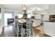 Open concept kitchen with an island, stainless steel appliances, and adjacent dining area at 356 Daugherty St, Columbus, IN 47201