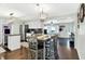 Eat-in kitchen features wooden dining table, white cabinetry, and stainless steel appliances at 356 Daugherty St, Columbus, IN 47201