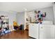 Bright laundry room features a washer, dryer, and storage space at 356 Daugherty St, Columbus, IN 47201