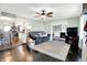 Cozy living room with an open floor plan, hardwood floors, a comfortable sofa, and access to the kitchen at 356 Daugherty St, Columbus, IN 47201