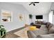 Inviting living room with vaulted ceilings, a large sectional sofa and lots of natural light at 356 Daugherty St, Columbus, IN 47201