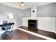 A cozy home office featuring an electric fireplace and hardwood flooring, providing a comfortable workspace at 356 Daugherty St, Columbus, IN 47201