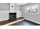 A cozy home office featuring an electric fireplace and hardwood flooring, providing a comfortable workspace at 356 Daugherty St, Columbus, IN 47201