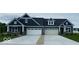 Beautiful duplex featuring attached garages, well-manicured lawns, and attractive blue siding for eye-catching curb appeal at 3866 Holly Brook Dr, Westfield, IN 46062