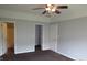 Carpeted bedroom featuring multiple closets and doors at 3908 Roundwood Dr, Indianapolis, IN 46235