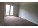Bedroom with carpet floors and sliding glass doors at 3908 Roundwood Dr, Indianapolis, IN 46235