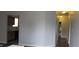 Hallway showcasing hardwood floors leading to the kitchen at 3908 Roundwood Dr, Indianapolis, IN 46235