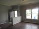 Living room featuring hardwood floors and a large window at 3908 Roundwood Dr, Indianapolis, IN 46235
