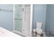 Bathroom featuring a walk-in shower with sliding glass door and a toilet at 4023 Cedar Hills South Dr, Greenwood, IN 46143