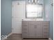 Bathroom featuring a single sink vanity with a gray cabinet and marble countertop at 4023 Cedar Hills South Dr, Greenwood, IN 46143