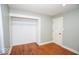 Bedroom with hardwood flooring, closet, and adjacent door at 4023 Cedar Hills South Dr, Greenwood, IN 46143