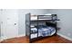 The ' bedroom has a bunk bed and hardwood floors at 4023 Cedar Hills South Dr, Greenwood, IN 46143