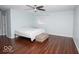 Spacious bedroom with hardwood floors, a ceiling fan, and plenty of natural light at 4023 Cedar Hills South Dr, Greenwood, IN 46143