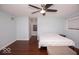 Spacious bedroom boasts hardwood floors, a ceiling fan, and a comfortable bed at 4023 Cedar Hills South Dr, Greenwood, IN 46143