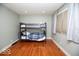 Bedroom with a bunk bed set and hardwood floors, bathed in natural light at 4023 Cedar Hills South Dr, Greenwood, IN 46143