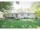 Charming single-story home with a well-maintained lawn and mature trees, offering great curb appeal at 4023 Cedar Hills South Dr, Greenwood, IN 46143