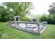 A fenced garden with raised planting beds and an arbor at 4023 Cedar Hills South Dr, Greenwood, IN 46143