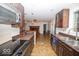 Modern kitchen with stainless steel appliances, granite counters, and an open view to the dining area at 4023 Cedar Hills South Dr, Greenwood, IN 46143