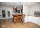 A kitchen bar area featuring a wood bar and ample storage at 4023 Cedar Hills South Dr, Greenwood, IN 46143