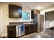 Well-equipped kitchen featuring stainless appliances, ample cabinets, and easy access to laundry area at 4023 Cedar Hills South Dr, Greenwood, IN 46143